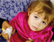  ?? — Reuters ?? A Palestinia­n child suffering from malnutriti­on receives treatment at Al Awda health centre in Rafah on Monday.