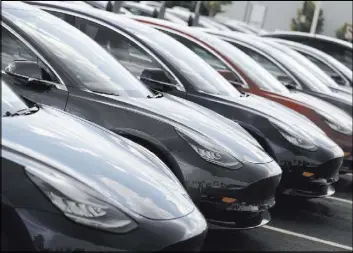  ?? David Zalubowski The Associated Press ?? 2018 Model 3 sedans sit on display outside a Tesla showroom in Littleton, Colo. The model was one of those recently tested for safety.