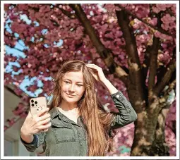  ?? ?? Precious moment...a woman takes a selfie on quiet day in Lviv