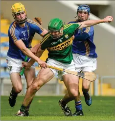  ??  ?? Barry O’Sullivan of Kerry in action against Matthew Traynor, left, and Christy Moorehouse of Wicklow.