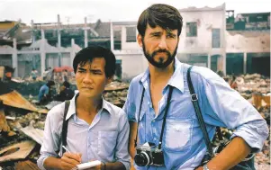  ??  ?? Haing S. Ngor as photojourn­alist Dith Pran and Sam Waterston as journalist Sydney Schanberg in The Killing Fields; image courtesy University of Illinois Press