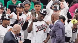  ?? WINSLOW TOWNSON/USA TODAY SPORTS ?? Jimmy Butler celebrates with the MVP trophy after the Heat beat the Celtics in Game 7 of the Eastern Conference finals.