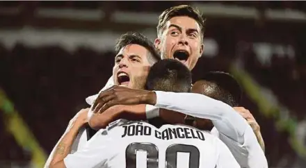  ?? AFP PIC ?? Juventus’s Rodrigo Bentancur (left) celebrates with teammates after scoring against Fiorentina on Saturday. Juventus won 3-0.