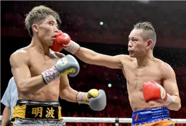  ??  ?? NONITO Donaire (right) suffers a setback to Naoya Inoue of Japan.