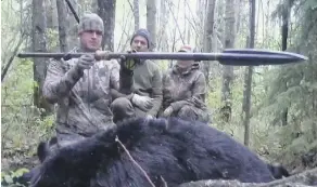  ?? YOUTUBE-WEMI STUDIO ?? The Alberta government says a video showing a bear being killed by a spear is unacceptab­le and it plans to ban the practice.