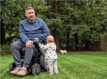  ?? Deanne Fitzmauric­e / Special to The Chronicle ?? Kevin Reid, shown with his infant niece, is a supporter of disability causes whose family-run Napa winery was sued by Andres Gomez over disabled access. The winery settled out of court.