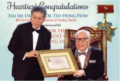  ??  ?? ... Founder and chairman of Public Bank Bhd Tan Sri Teh Hong Piow (right) has been awarded the ‘Medal for the Developmen­t of Vietnam Banking Industry’ by the State Bank of Vietnam, making him the first foreign banker in Vietnam to receive the medal....