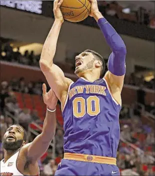  ?? GETTY ?? Enes Kanter grabs a board over Andre Drummond and Knick center is his usual scrappy self Friday, recording a double-double with 22 points and 16 rebounds.