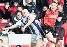  ??  ?? Chris Marsh, right, in action for Walsall against Colchester in 2001