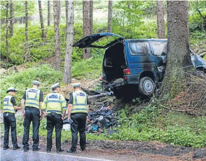  ?? Picture: Steve MacDougall. ?? Police at the scene of the collision near Spittalfie­ld in Perthshire.