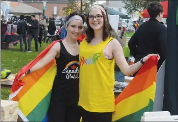  ?? NEWS PHOTO MO CRANKER ?? Karlie Grover and Maddy Campbell show off their pride Saturday during the annual Pride in the Park celebratio­n. The Medicine Hat Pride Associatio­n held a Pride Week for the first time this year, which president Rosie Joa said was a success.