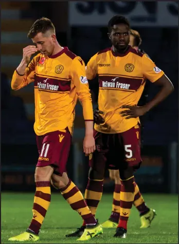  ??  ?? Gael Birgiriman­a and Elliot Frear were dejected after a late comeback came to nothing in Dingwall