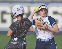  ?? STAFF PHOTO BY MATT HAMILTON ?? Chattanoog­a Christian School’s Ella Claire Chaffin can’t make the throw to first in time to turn two after Silverdale Baptist Academy’s Emry Masterson (7) was out at second base during Thursday’s game.