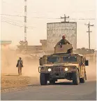  ?? AFP/GETTY IMAGES ?? Afghan security forces travel in a Humvee, amid battles between Taliban militants and Afghan forces, in Kunduz in 2015.