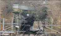  ?? PICTURE: TONY JOHNSON. ?? LINE BLOCKED: A landslip in Spring Wood, Guiseley, Leeds has temporaril­y closed the Ilkley to Leeds railway line.