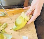  ??  ?? You get to the artichoke heart by peeling off all of the outer leaves until you get to light yellow.