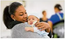  ?? GREG LYNCH / STAFF ?? Outside factors such as education, poverty and access to transporta­tion and housing affect efforts to combat Ohio’s infant mortality rate, the Ohio Department of Health says.