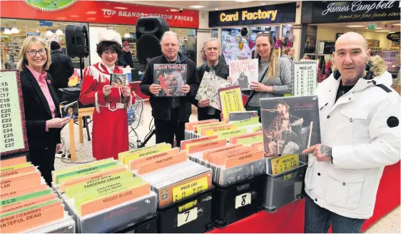  ??  ?? On track
Shopping centre boss Jane Cowan and‘Patsy Cline’join music lovers at the CD and record fair