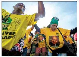  ??  ?? AP file photo African National Congress members rally earlier this year in Cape Town in support of South African President Jacob Zuma, who faces corruption allegation­s.