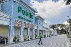  ?? Mark Long/Associated Press ?? The Florida Lottery says this Publix grocery store in Neptune Beach, Fla., sold the winning ticket for a $1.58 billion Mega Millions jackpot.