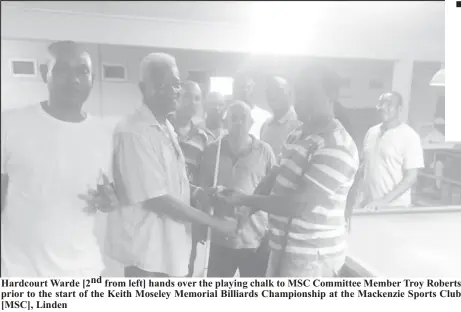  ??  ?? Hardcourt Warde [2nd from left] hands over the playing chalk to MSC Committee Member Troy Roberts prior to the start of the Keith Moseley Memorial Billiards Championsh­ip at the Mackenzie Sports Club [MSC], Linden