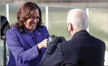  ?? JONATHAN ERNST / POOL PHOTO VIA AP ?? Vice President Kamala Harris bumps fists with President-elect Joe Biden after she was sworn in during the 59th Presidenti­al Inaugurati­on at the U.S. Capitol in Washington Wednesday.