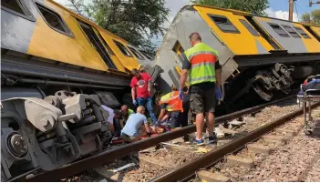  ?? Pictures: SUPPLIED ?? HELPING HANDS: Emergency services personnel and police treat injured passengers in Tuesday’s train accident in Pretoria.