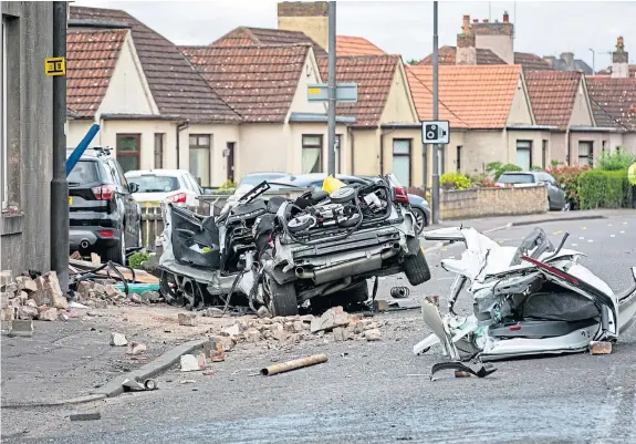  ?? Pictures: Steve Brown. ?? A number of vehicles were damaged in the crash and a window of a house was smashed by debris from the impact.