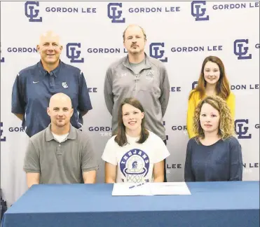  ??  ?? Recent Gordon Lee High School graduate Abby Dalton (seated, center) signed her letter of intent last Tuesday to play basketball for Georgia Northweste­rn. Also on hand for the ceremony was Brad and Candi Dalton. On the back row was Gordon Lee girls’...