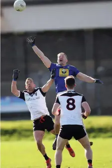  ??  ?? Neil Ewing and Patrick O’Connor of Sligo in an aerial tussle with Wicklow’s Dan Healy on Sunday. Pics: Joe Byrne.