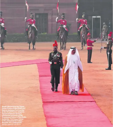  ?? Manish Swarup / AP Photo ?? Sheikh Mohammed bin Zayed, Crown Prince of Abu Dhabi and Deputy Supreme Commander of the Armed Forces, inspects a guard of honour during a ceremonial reception at the Presidenti­al Palace in New Delhi, yesterday. The Crown Prince is the chief guest for...