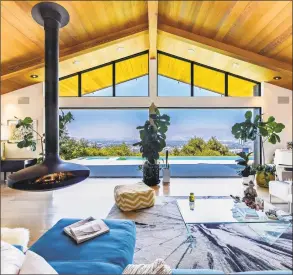  ?? Wayne Ford / TNS ?? Actress Jennie Garth sold her updated home, which has a "Jetsons"- style hanging fireplace, in Studio City for about $ 4.48 million.
