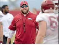  ?? NWA Democrat-Gazette/ANDY SHUPE ?? Arkansas offensive line coach Dustin Fry has been shuffling players to different positions while dealing with several injuries during the Razorbacks’ preseason camp.