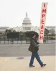  ?? Erin Scott / REUTERS ?? A demonstrat­or outside the U. S. Capitol on Monday.