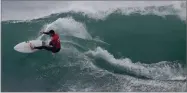  ?? AP PHOTO BY SILVIA IZQUIERDO ?? Argentina’s Santiago Muniz competes in the men’s open surfing repechage round 2 during the Pan American Games on Punta Rocas beach in Lima Peru, Wednesday, July 31.