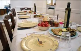 ?? CAIN BURDEAU VIA AP ?? This photo shows a table set with appetizers for lunch at the Arrosteria Borgo Antico, a restaurant in the historic center of Ceglie Messapica, a town known for its good food in the Valle d’Itria in Puglia, Italy.