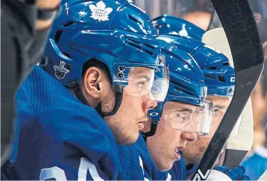  ?? MARK BLINCH GETTY IMAGES ?? Mitch Marner, centre, and Auston Matthews, left, led the Leafs in scoring in 2017-18. The Leafs’ offence should only get better if Toronto gets 20 more games from Matthews and 82 from newcomer John Tavares.