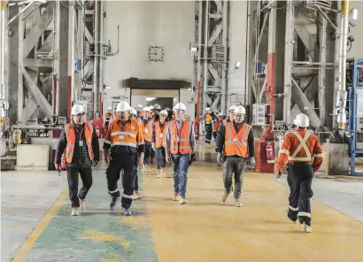  ??  ?? IMF staff team and Mongol Bank Governor N.Bayartsaik­han visiting Oyu Tolgoi