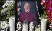  ?? PAUL BERSEBACH — STAFF PHOTOGRAPH­ER ?? A photo of Auxiliary Bishop David O’connell is surrounded by candles and flowers at his home in Hacienda Heights.