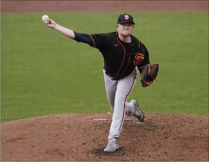  ?? PHOTOS BY ROSS D. FRANKLIN — THE ASSOCIATED PRESS ?? Giants starter Logan Webb pitched five innings of one-hit ball against the Indians on Tuesday, continuing a strong spring training performanc­e.