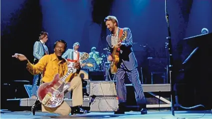  ?? COURTESY OF KEW MEDIA ?? Chuck Berry, left, in a scene from the documentar­y “Chuck Berry: The Original King of Rock ’N’ Roll.”