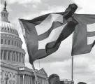  ?? JACQUELYN MARTIN/AP FILE ?? “Equality flags” fly during a Capitol Hill event in support of transgende­r members of the military.