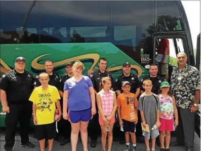  ?? RENSSELAER COUNTY SHERIFF’S OFFICE ?? Rensselaer County Sheriff Pat Russo, right, and several deputies send off six county children who are attending the New York State Sheriffs Associatio­n Institute’s 2016 Summer Camp in the Finger Lakes region.