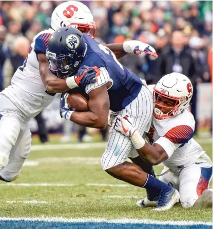  ?? HOWARD SIMMONS/AP ?? Running back Dexter Williams crosses the goal line to score Notre Dame’s first touchdown Saturday against Syracuse at Yankee Stadium.