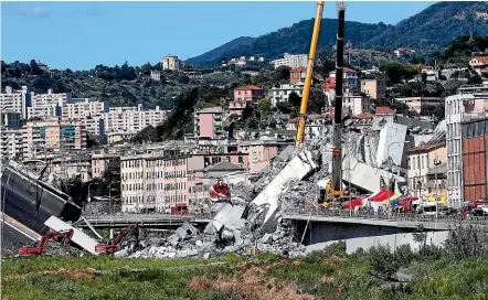  ?? AP ?? Rescuers work among the rubble of the Morandi highway bridge that collapsed in Genoa, northern Italy. Experts say many other pieces of transport infrastruc­ture are at risk in Italy.
