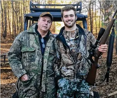  ?? CHIP TOWERS / DAWGNATION.COM ?? Georgia quarterbac­k Jake Fromm is most at home with his maternal grandfathe­r, Bill Haskins, deep in the backwoods of Central Georgia deer country, seen here last December.