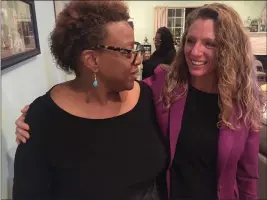  ?? RICH FREEDMAN — TIMES-HERALD ?? K. Patrice Williams gets a squeeze from supporter, Vallejo City Councilmem­ber Pippin Dew, at Tuesday’s election night gathering.