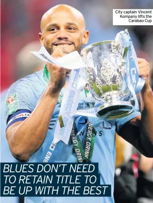  ??  ?? City captain Vincent Kompany lifts the Carabao Cup