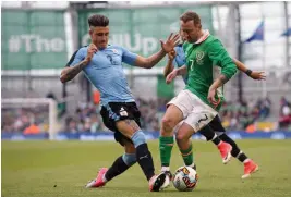  ?? — AFP — AP ?? Uruguay’s Jose Maria Gimenez (left) and Ireland’s Aiden McGeady vie for the ball.