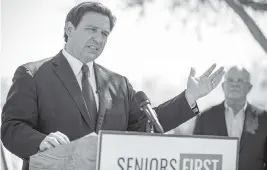  ?? ALAN YOUNGBLOOD AP ?? Florida Gov. Ron DeSantis speaks to the media as he visited the drive-thru COVID-19 vaccinatio­n site at On Top of the World in Ocala on March 5.